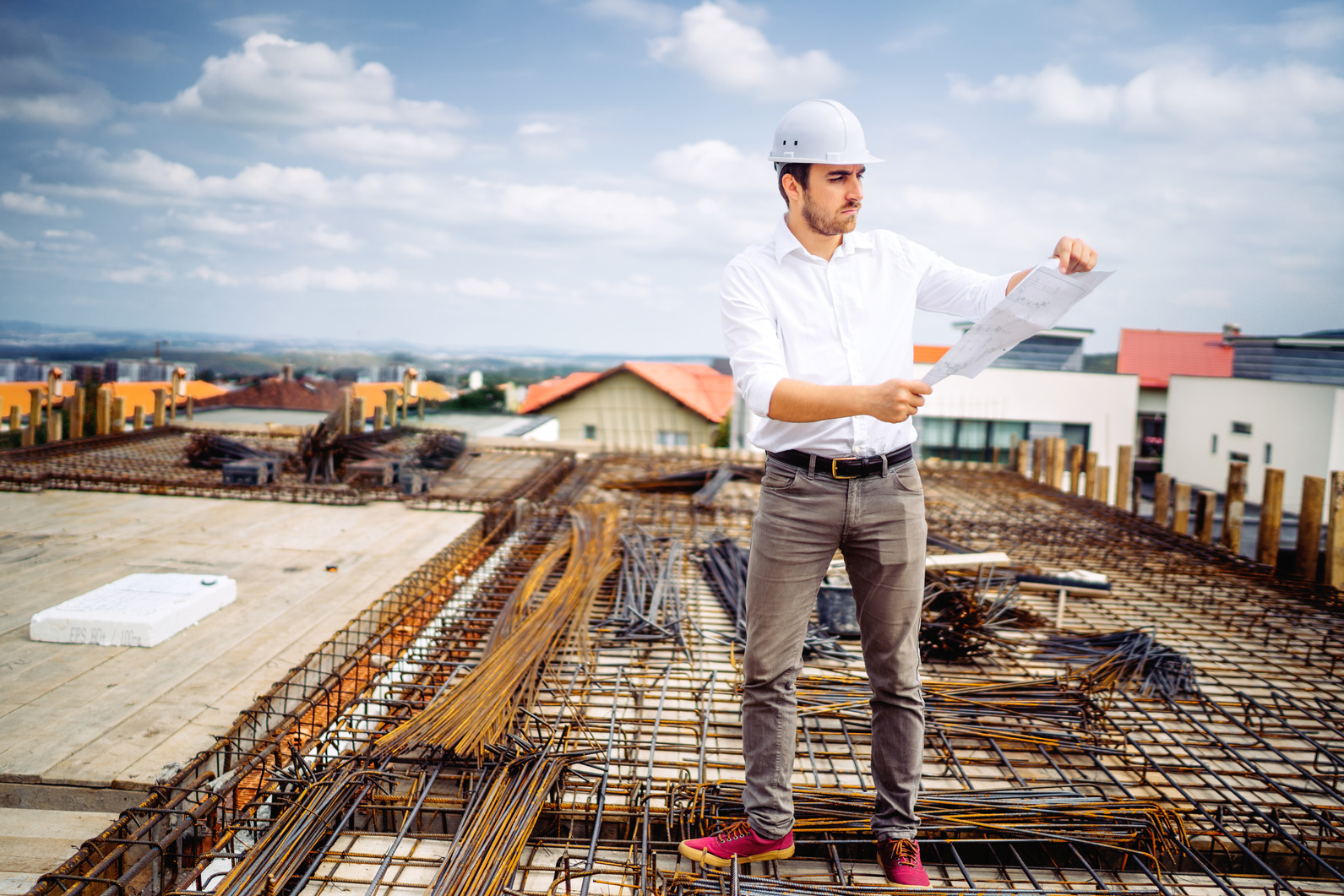 engineer on construction site working and supervising workers